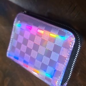 Shiny Lavender wallet.  Checkered pattern.  New with box.  Lots of card spots